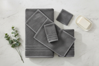 6-piece dark grey Turkish cotton towel set on marble countertop