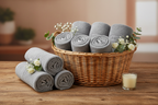 6-piece pale grey towel set in a wicker basket with flowers