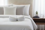 Contour Legacy Leg Pillow on Bed with Sleep Accessories
