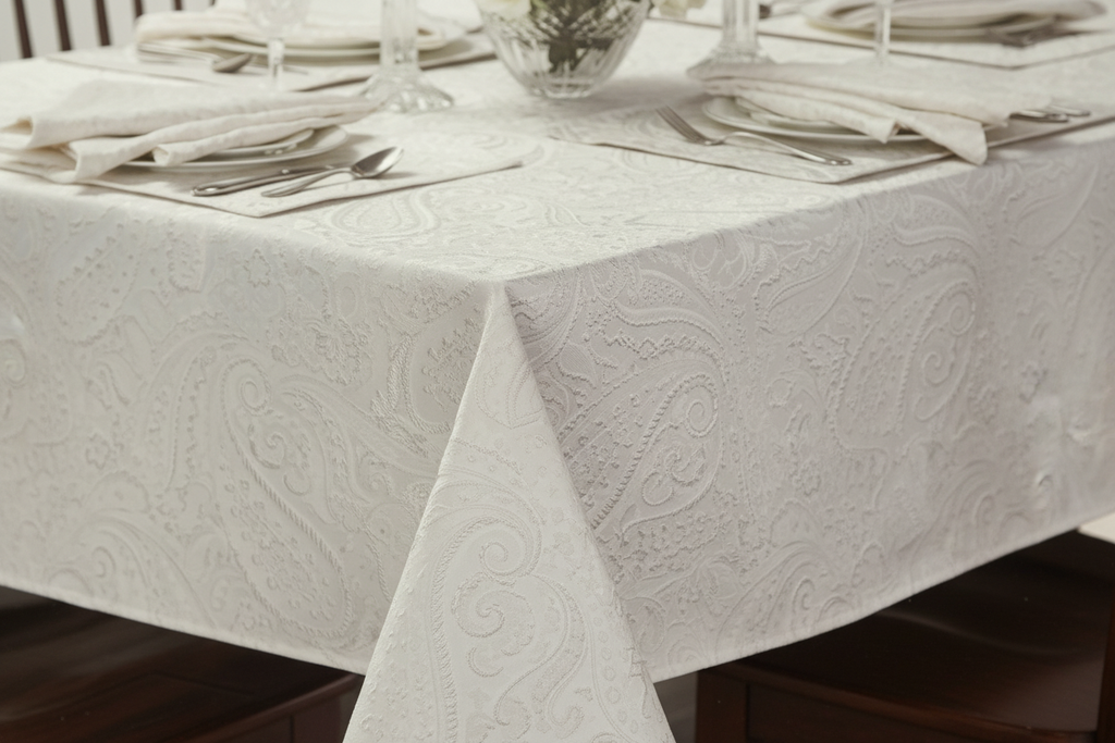 Close-up of white paisley jacquard damask tablecloth woven pattern