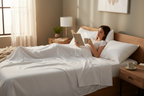 Person Relaxing in Bed with White Bamboo Sheets