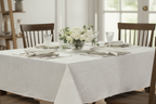 White Damask Tablecloth on Wooden Table with White and Green Flowers