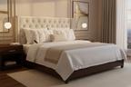 White pinch-pleat pillows against upholstered headboard