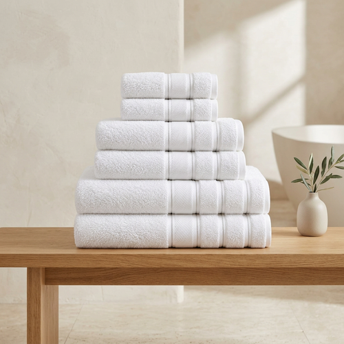 White Turkish towel set in a warm minimalist bathroom